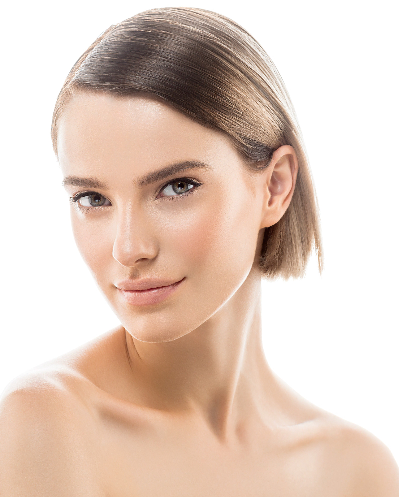 Female model with short hair against a white background