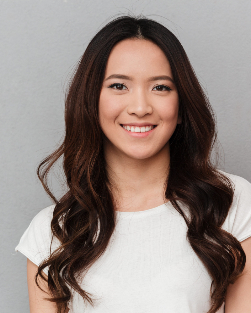 Smiling woman afterr cheek, chin & jaw enhancement