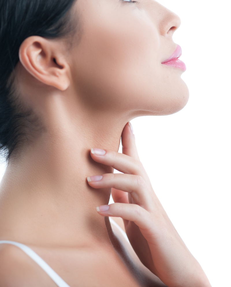 Woman touching her double chin area