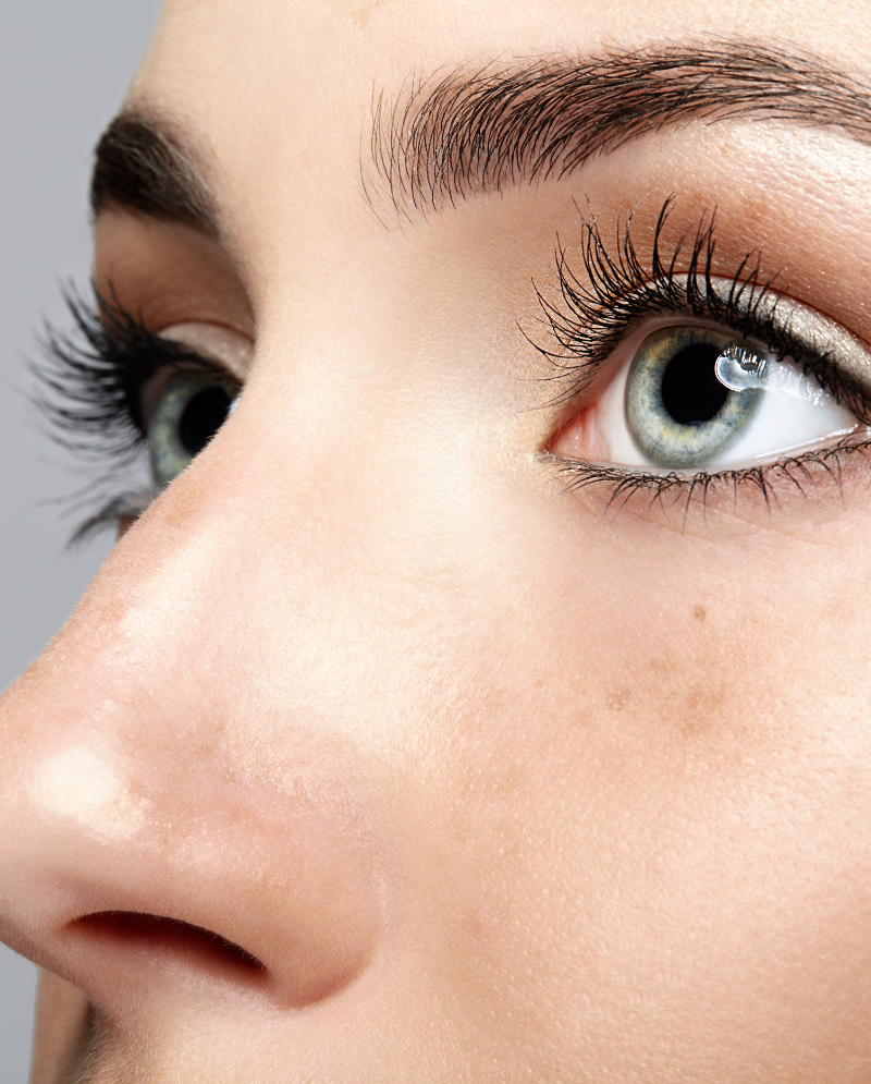 Close-up on a woman's blue eyes