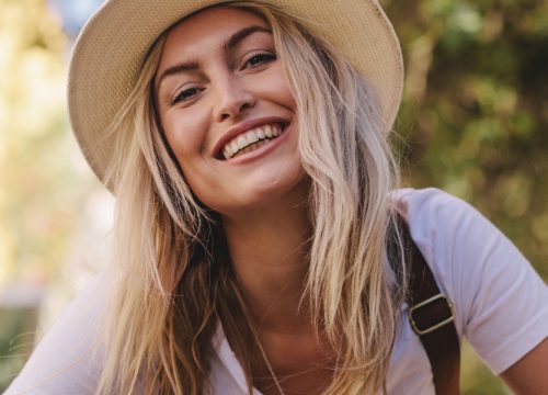 Happy blonde woman after microneedling + prp treatments