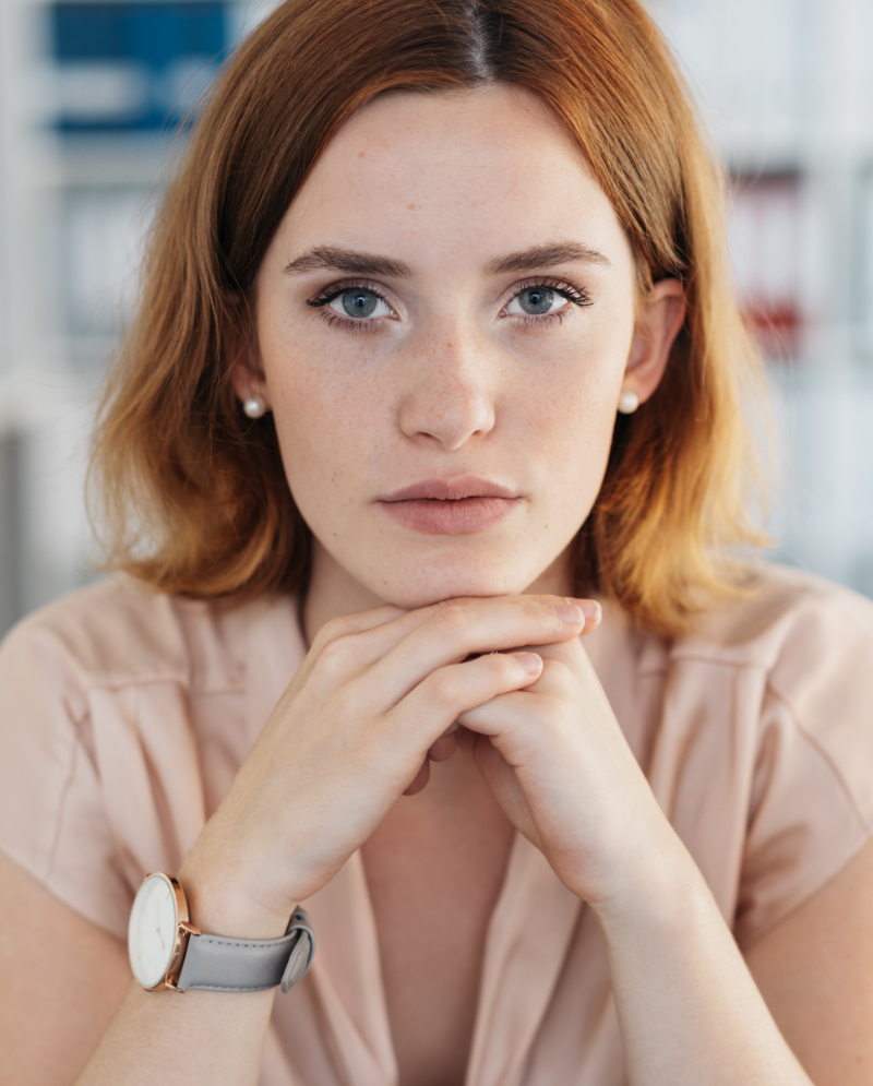 Concerned woman with skin growths and warts